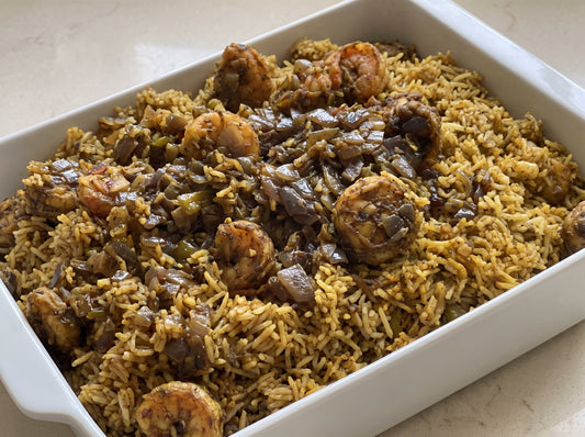 Kuwaiti Murabyan in a white dish - golden basmati rice with shrimp and caramelized onion topping